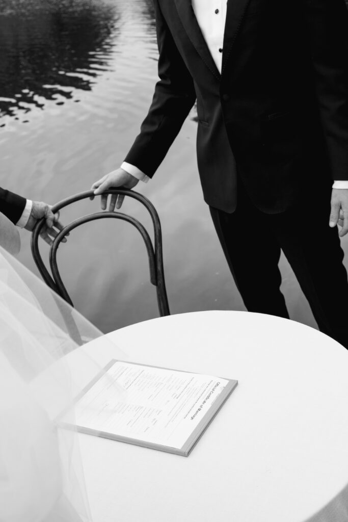 a detailed shot of a groom pulling out a chair at Barragunda Estate Cape Schanck