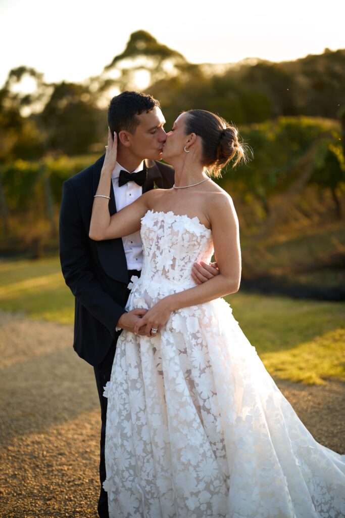a newlywed couple kiss during golden hour at Jackalope Hotel on the Mornington Peninsula