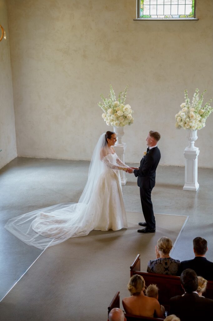 a couple during their wedding ceromony at Stones of the Yarra Valley