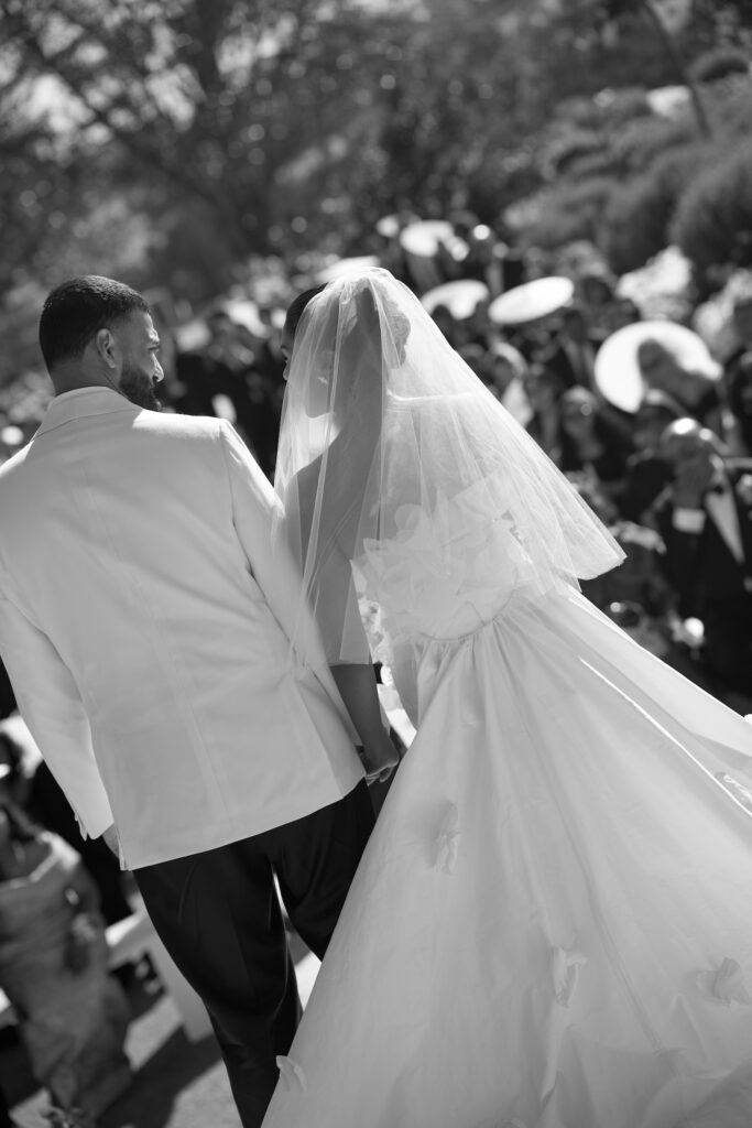 A bride and groom embracing (photo from behind) at their wedding ceremony at Sunnyside Events on the Mornington Peninsula